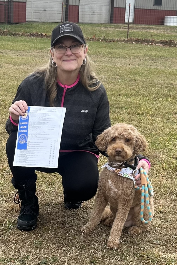 The dog and its owner at the graduation from the personal support dog class